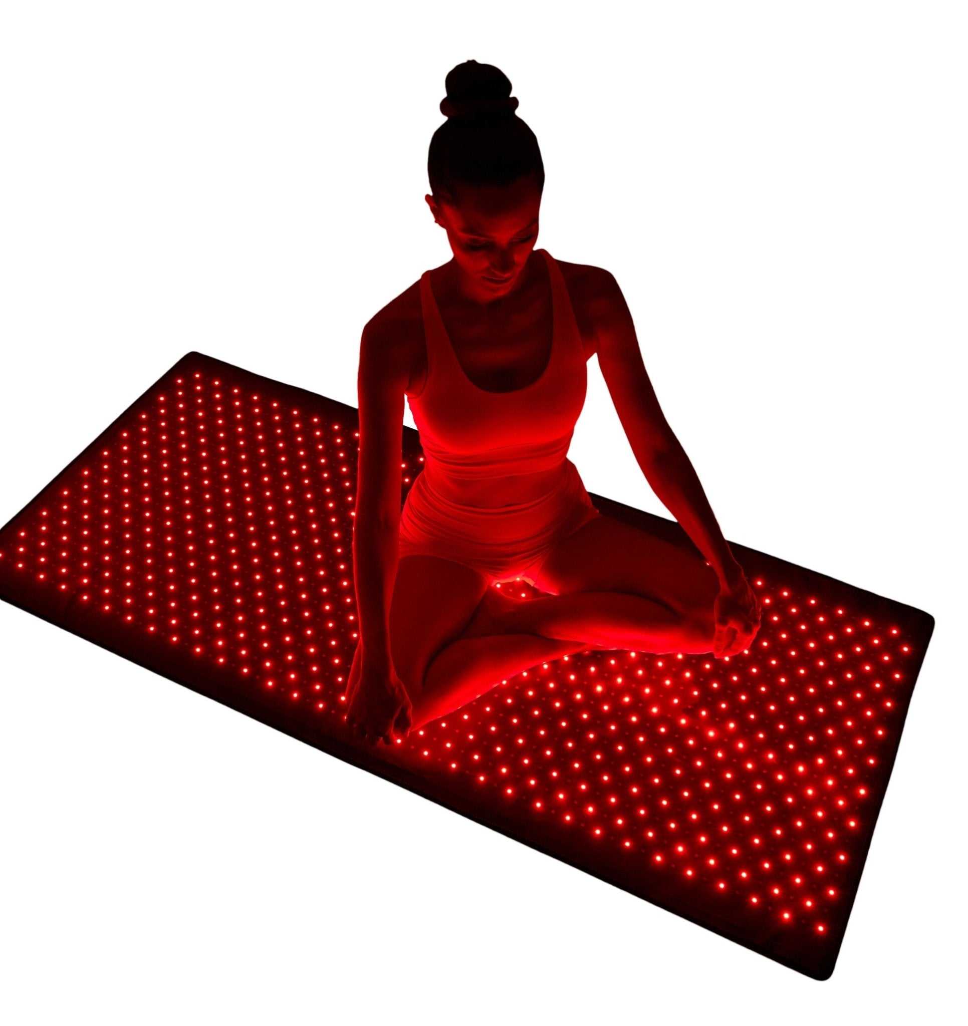 Person using Nushape full-body red light therapy mat with 660/850nm LEDs for recovery and energy boost