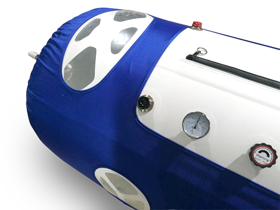 Close-up detail of a transparent viewport window on the 1.4 ATA hyperbaric chamber