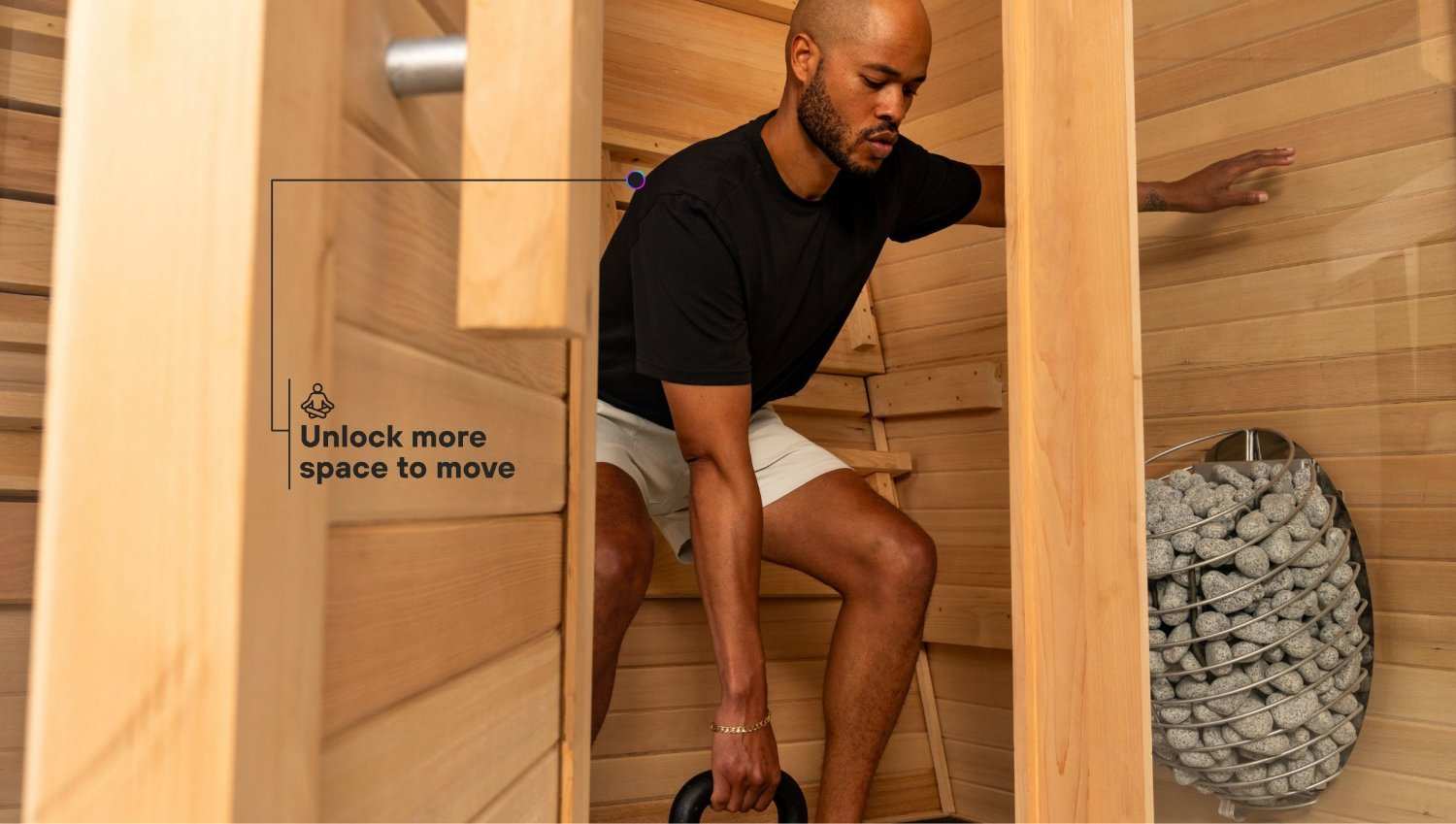 Man exercising inside premium indoor/outdoor infrared sauna with cedar wood interior and ergonomic backrest