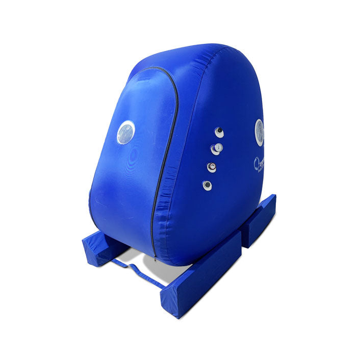 Front view of the vertical hyperbaric chamber showing the wide wheelchair-accessible entry door