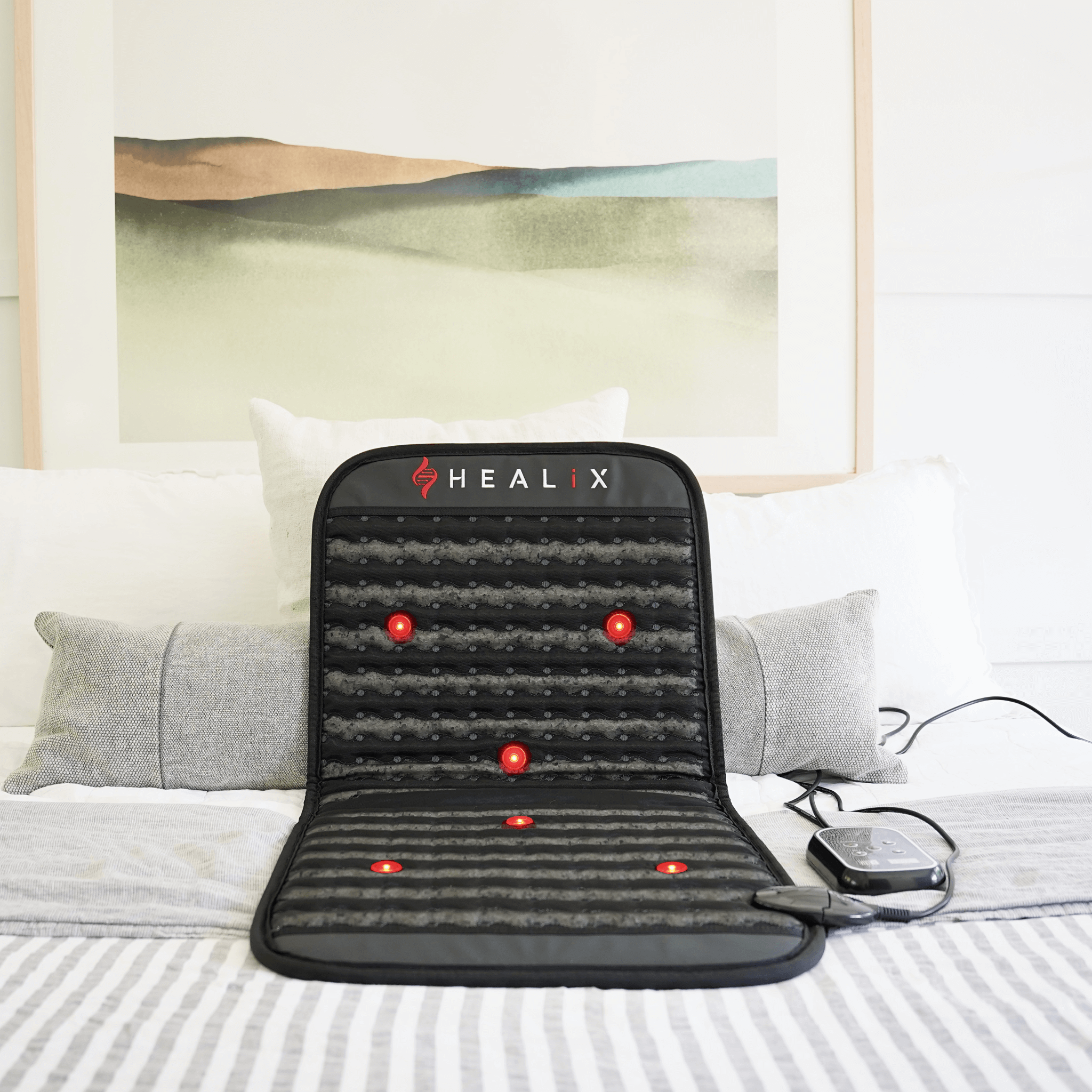 HEALiX Revive Mini portable PEMF, Far Infrared and Red Light therapy mat on bed