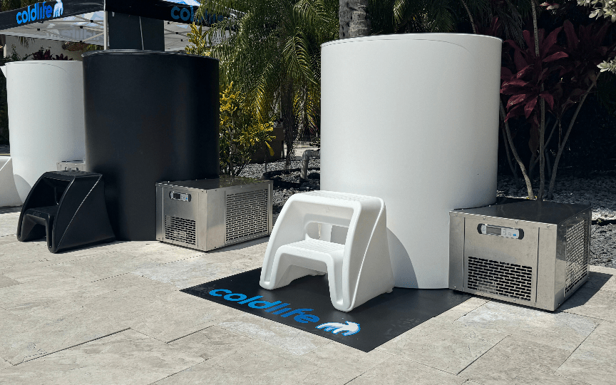 Pro Curve Chiller commercial cold plunge unit with patented curved design and cooling system placed outdoors next to plunge tubs.