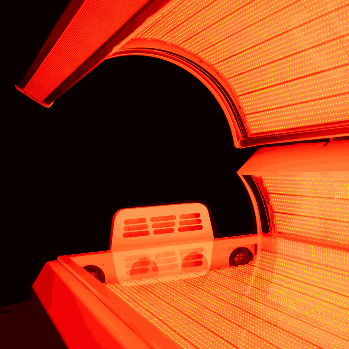 Commercial red light therapy bed with 360-degree LEDs and cooling fans