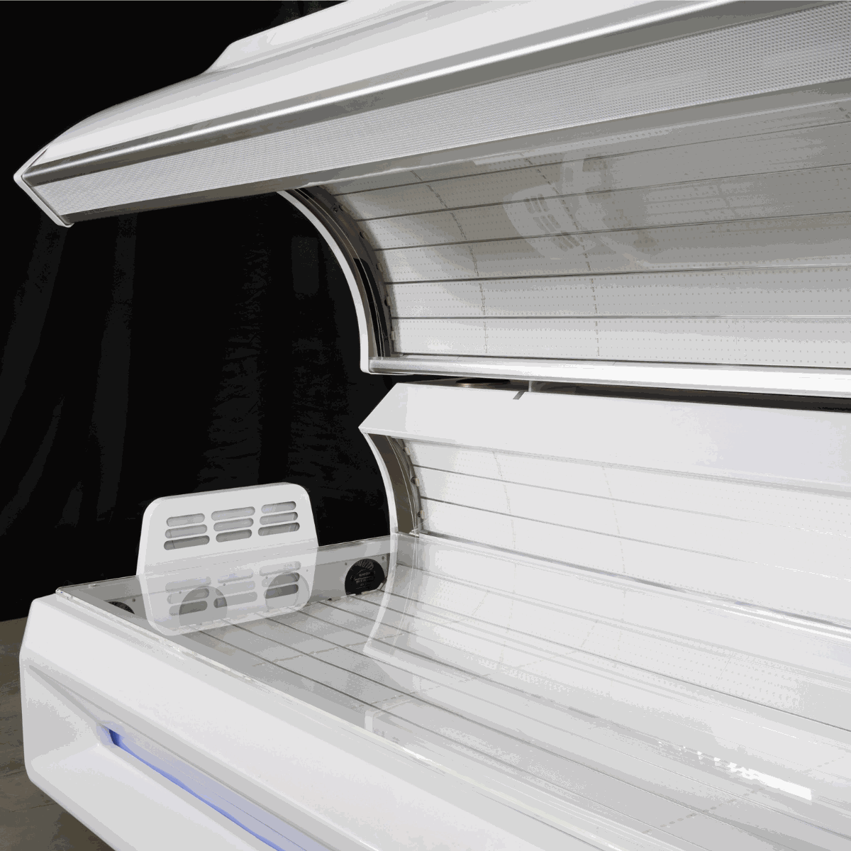 Airvida Radiance red light therapy bed with 360-degree LEDs, plasma cooling fans, commercial controls, built-in timer, and integrated music system for home and commercial use