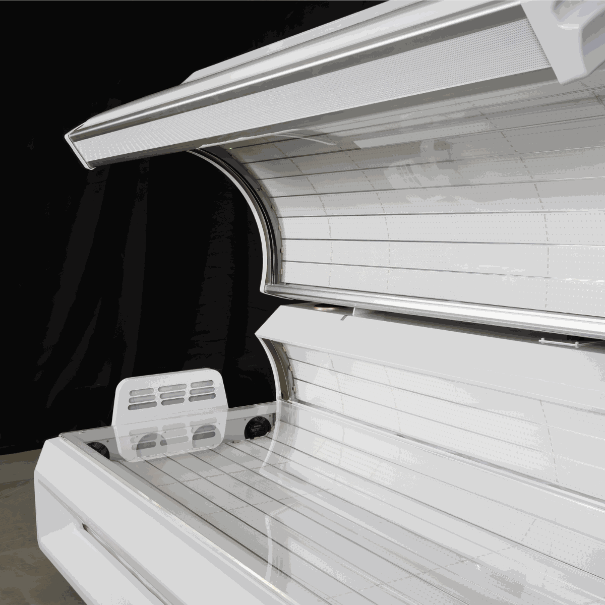 White red light therapy bed with 360-degree LED lights and commercial control system opened in studio setting