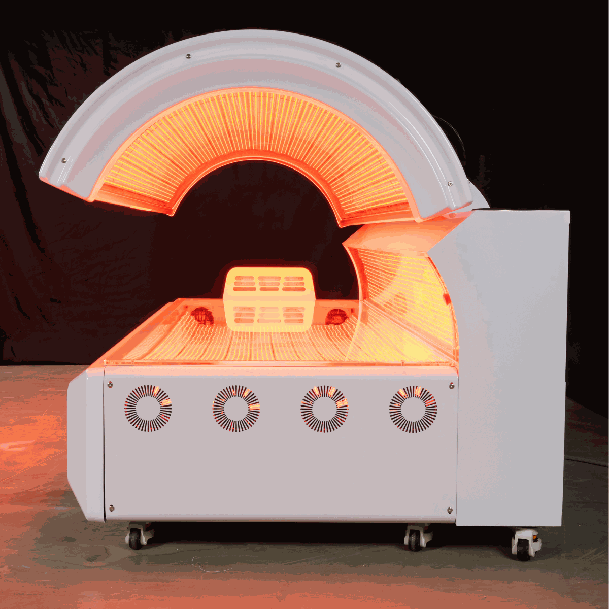 Modern red light therapy bed with 360-degree LEDs and cooling fans for home and commercial use