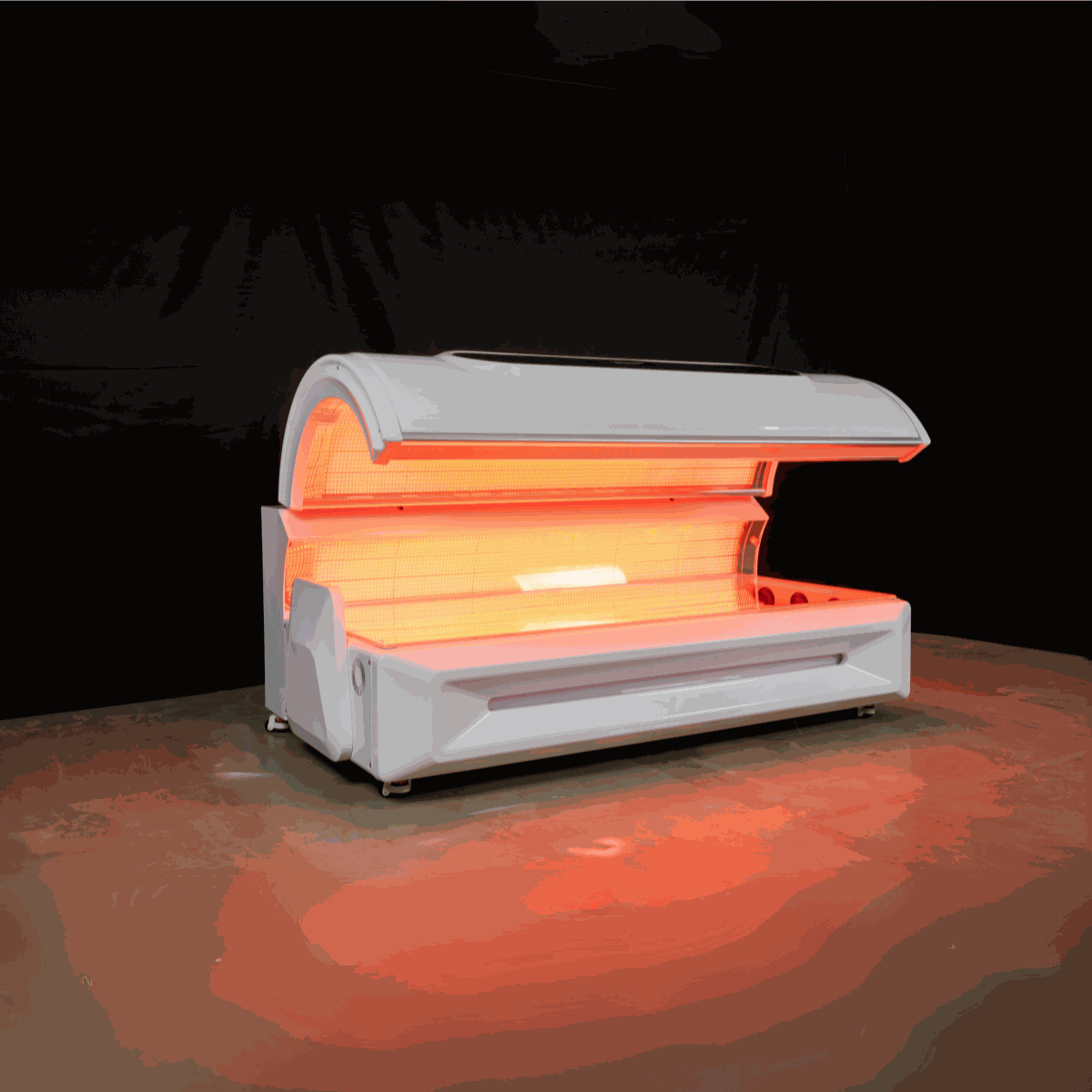 Commercial-grade red light therapy bed with 360-degree LEDs, built-in timer, cooling fans, and integrated music system for home and business use