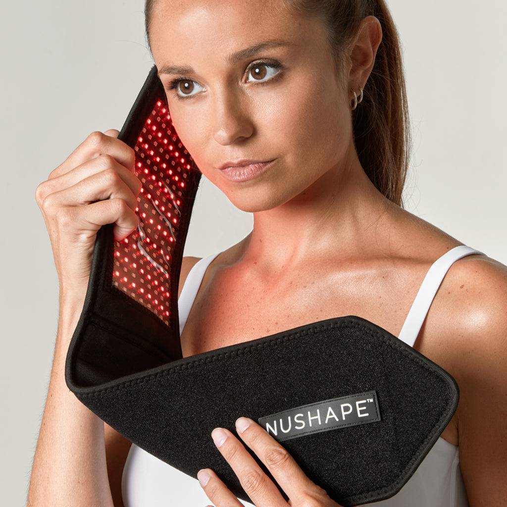 Woman holding portable red light LED wrap Nushape Mini for pain relief therapy
