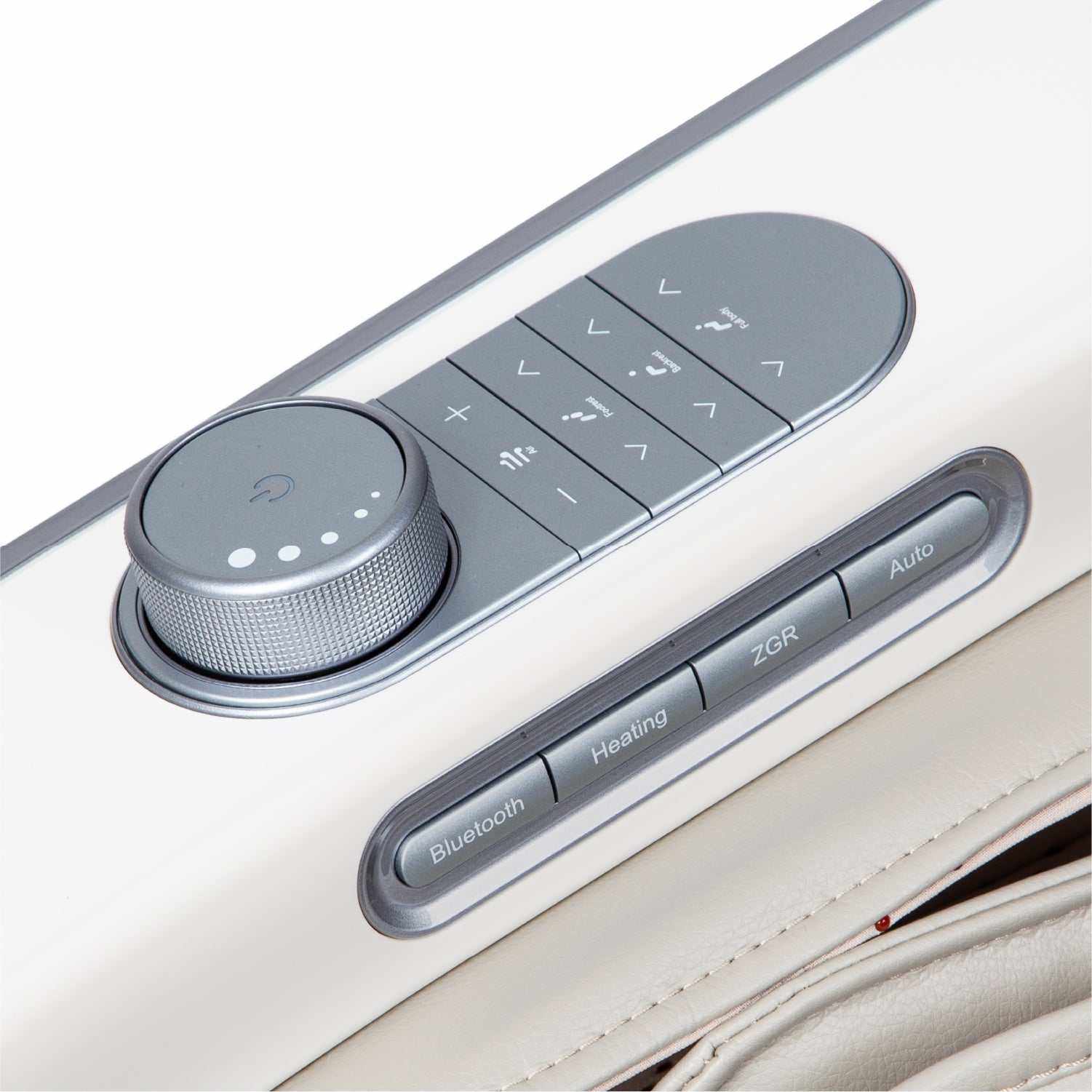 Close-up of JP-Nexus 4D massage chair control panel with Bluetooth, heating, zero-gravity recline, and auto buttons.