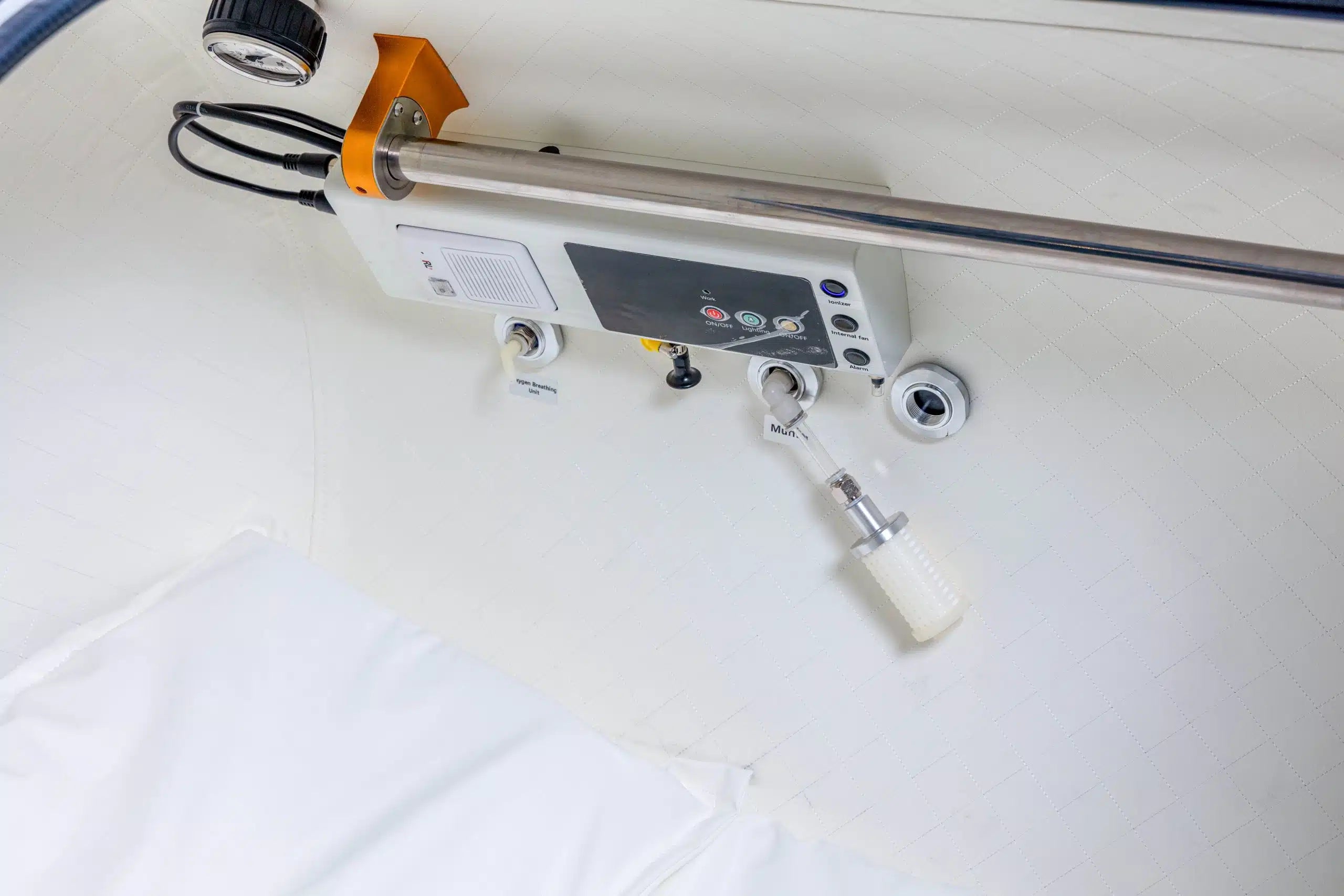 Hard-shell hyperbaric chamber detail view with onboard oxygen system