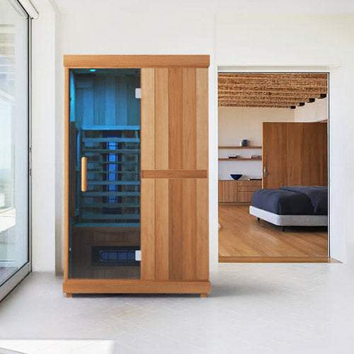 Finnmark FD-2 full-spectrum infrared sauna with wooden exterior and glass door in modern home setting