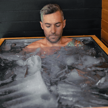 Man using Luxury Plunge ice bath with sleek insulated stainless steel tub and ice-cold therapy