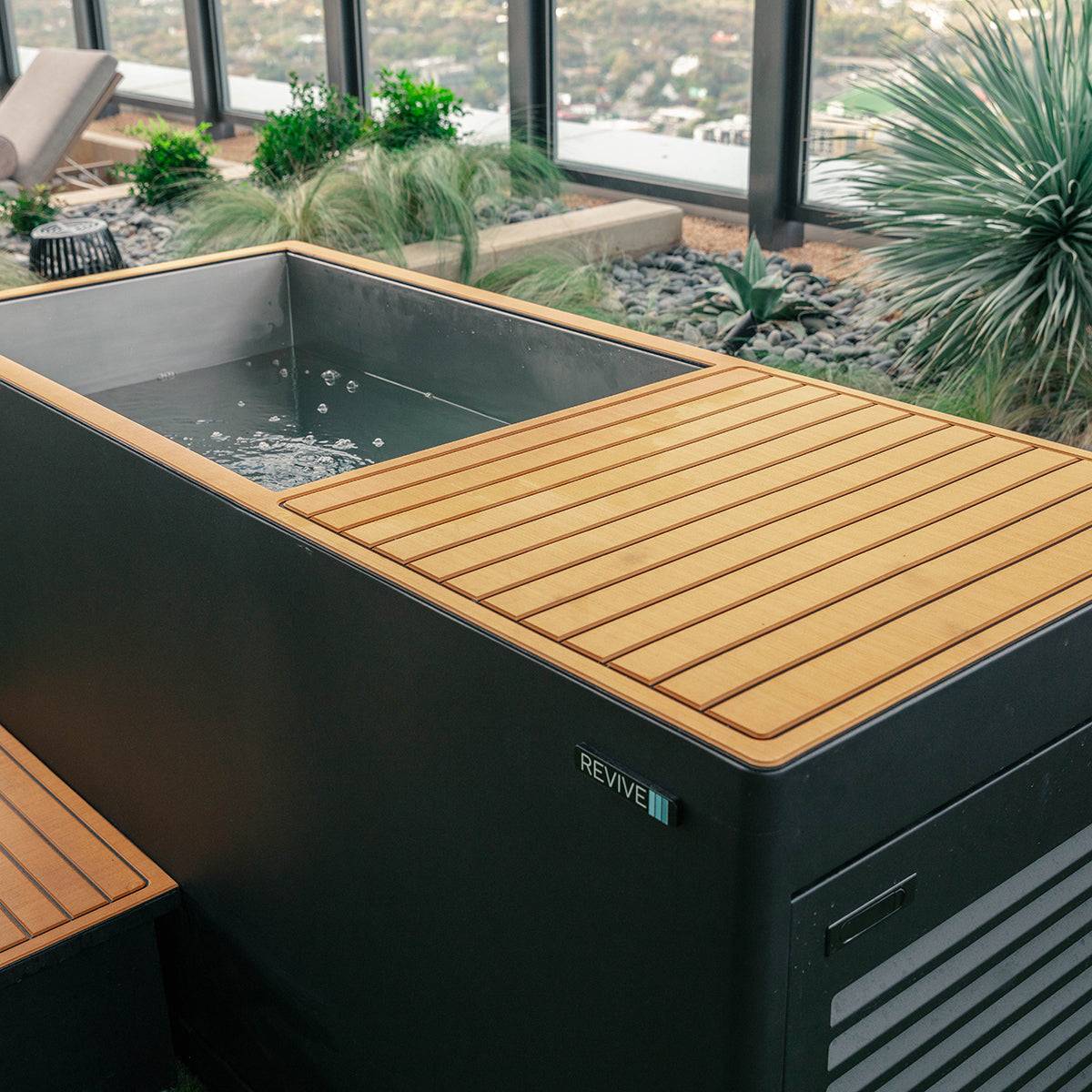 Luxury Plunge cold therapy tub with insulated stainless steel and wooden cover in outdoor setting