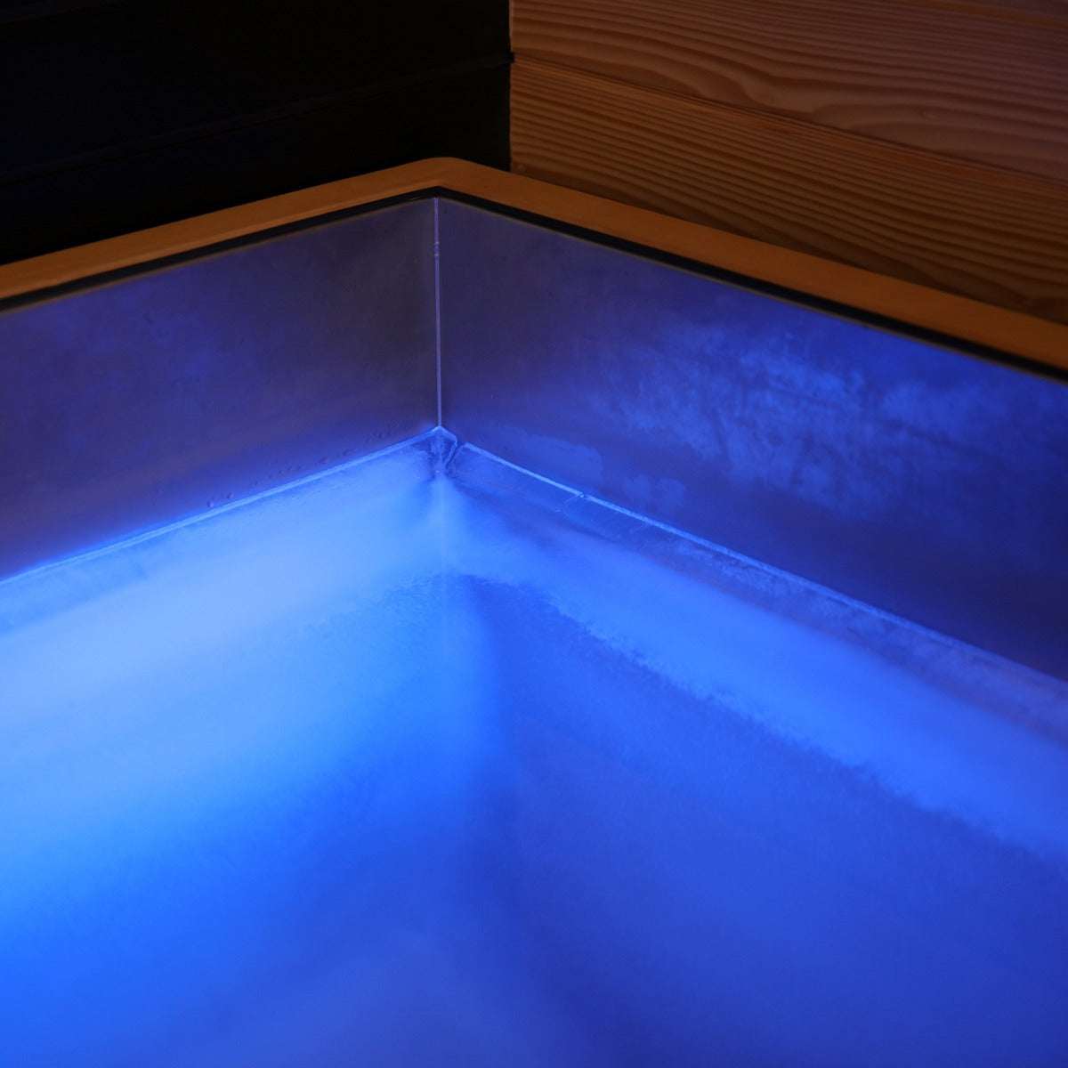 Luxury Plunge cold therapy tub with blue LED lighting and insulated stainless steel interior corner