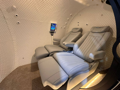 Reclining seats inside the multiplace chamber