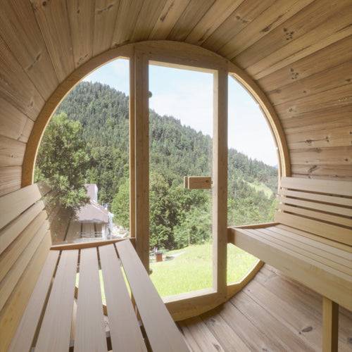 SaunaLife Model E7G outdoor barrel sauna with glass front and wooden benches overlooking forest view