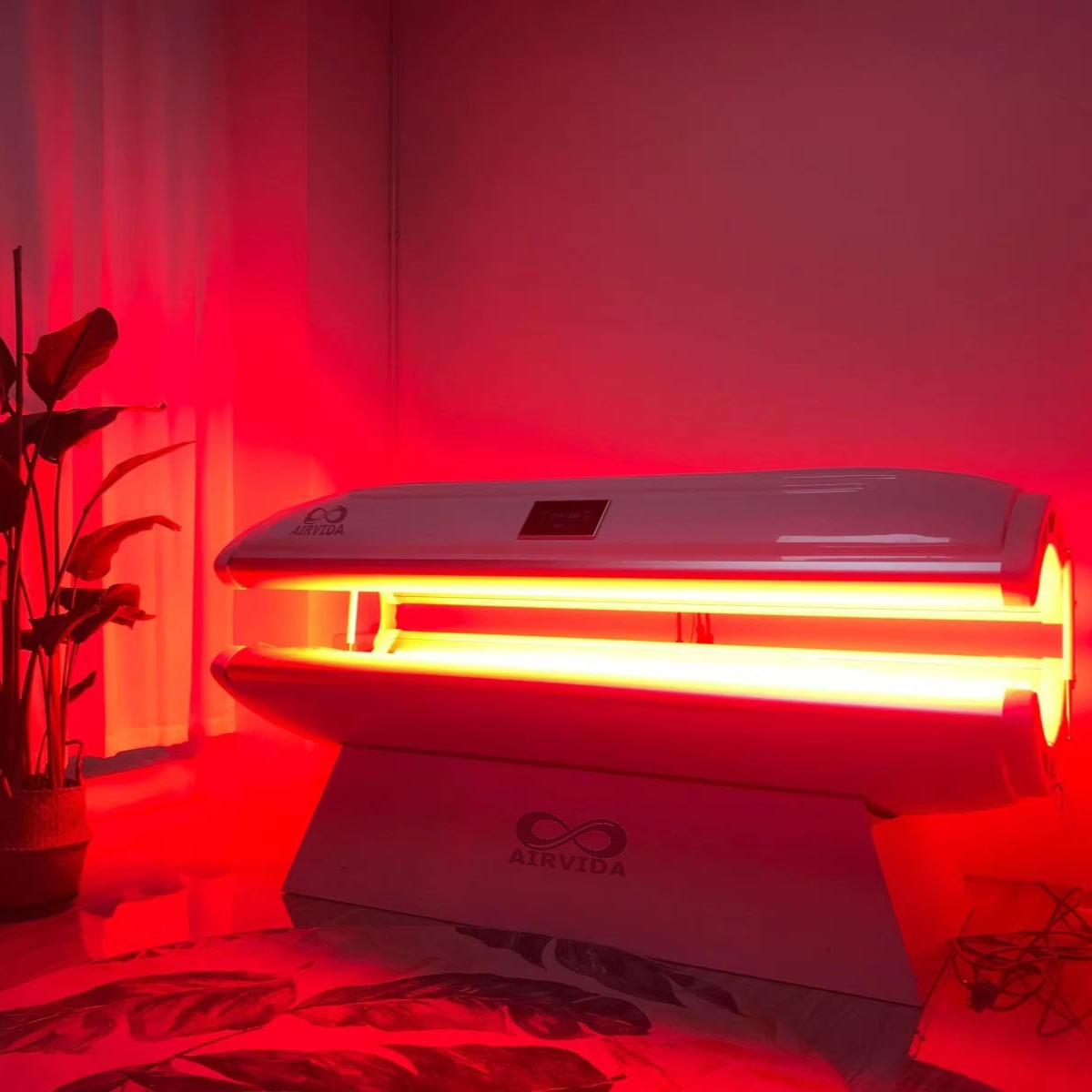 Airvida Aura red light recovery system bed illuminated in red light for home and commercial use with biotech design and Bluetooth speakers