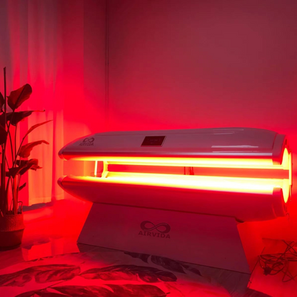 Airvida Aura red light recovery system bed illuminated in red light for home and commercial use with biotech design and Bluetooth speakers