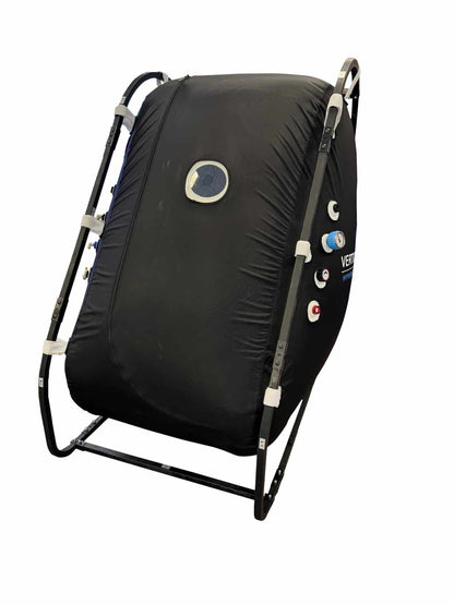 Vertical mini hyperbaric chamber with internal steel frame and viewport windows