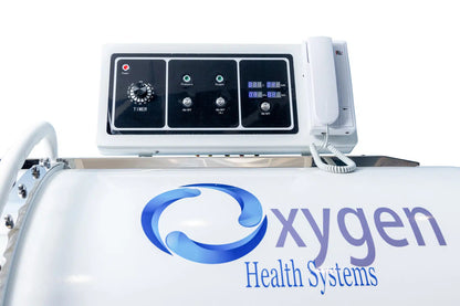 Single-person lie-down hyperbaric chamber showing padded interior and door
