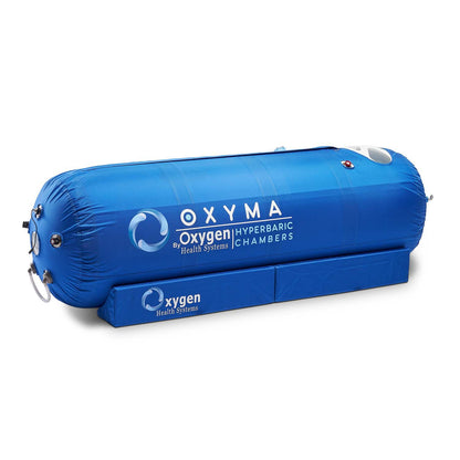 Oxyma hyperbaric oxygen chamber showing the 28-inch diameter lie-down design and internal steel frame